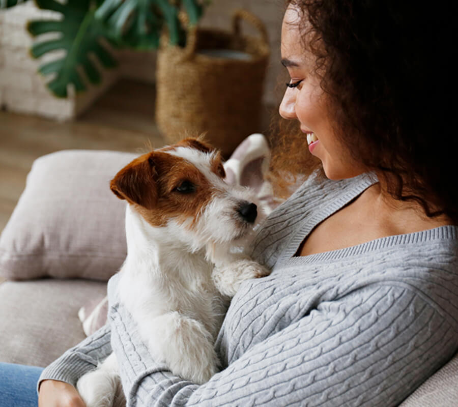 Woman with dog on couch